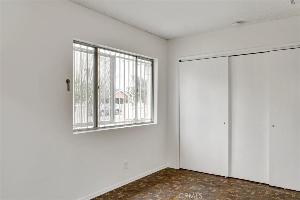 10661 Ilex Avenue Pacoima, CA 91331 - Photo 13 of 22 a view of a room that has a window in it