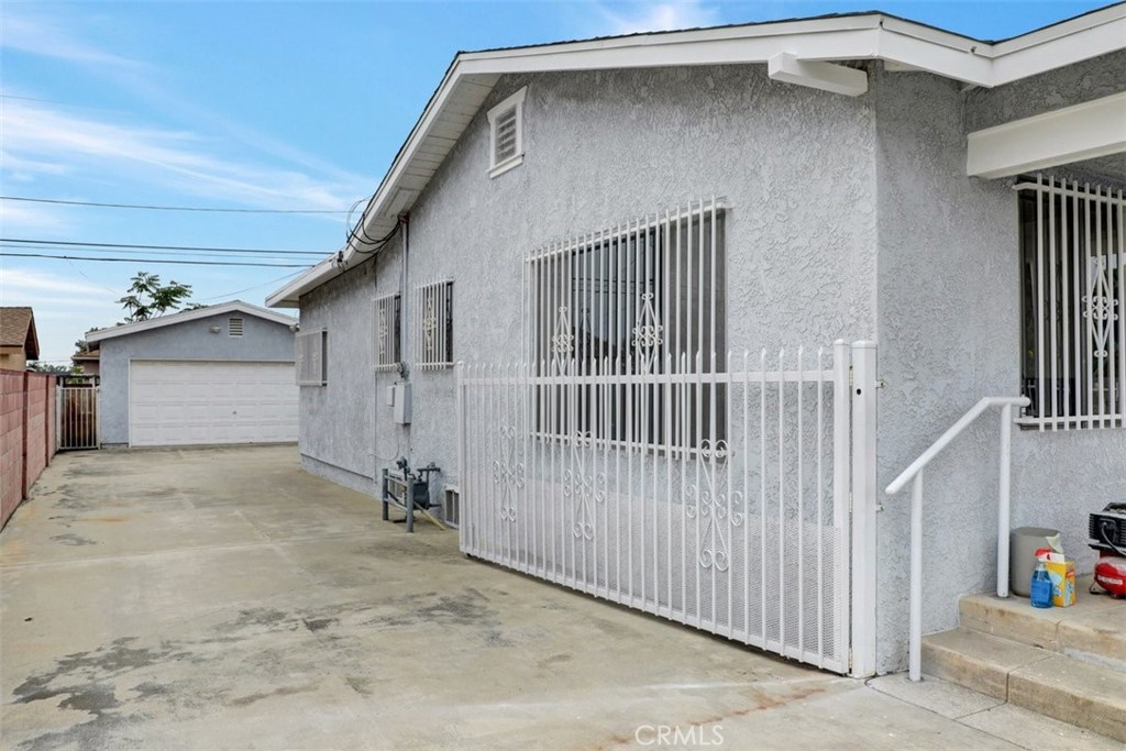 10661 Ilex Avenue Pacoima, CA 91331 - Photo 15 of 22 a view of a house with wooden fence