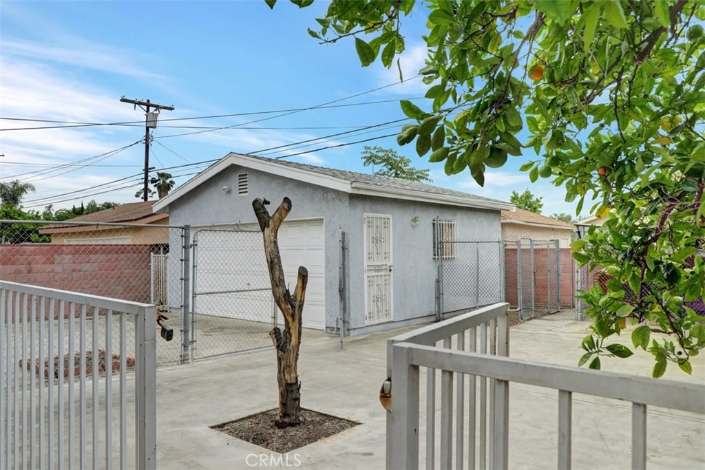 10661 Ilex Avenue Pacoima, CA 91331 - Photo 19 of 22 a front view of a house having yard