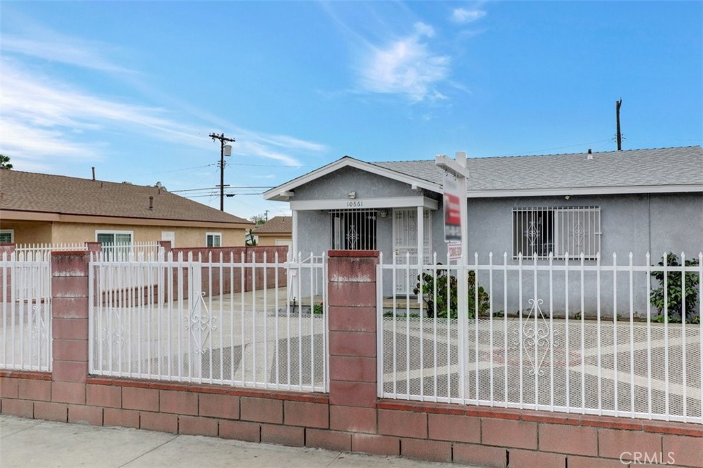 10661 Ilex Avenue Pacoima, CA 91331 - Photo 2 of 22 a front view of a house with a porch