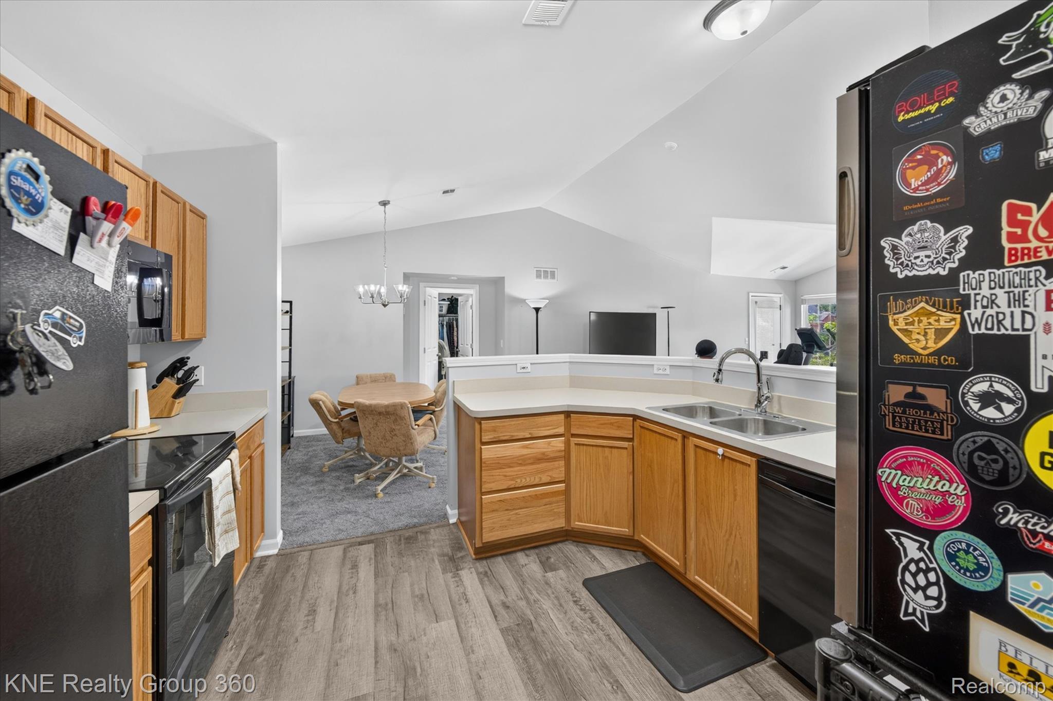 4077 Berkeley Avenue Canton, MI 48188 - Photo 15 of 32 Kitchen featuring wood-finish flooring, light wood cabinetry, and a double basin sink