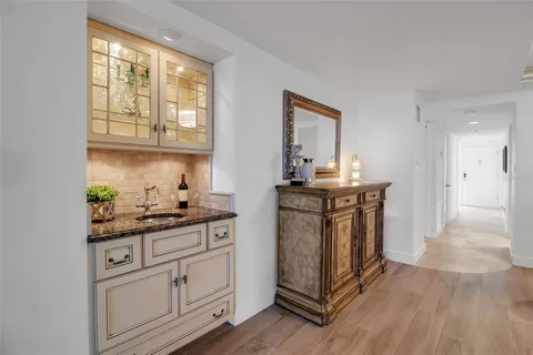 a view of a room with chairs and city view