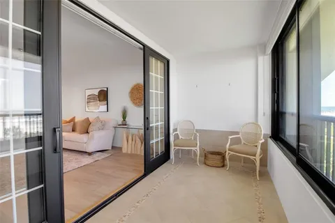 a bathroom with a granite countertop sink a large mirror and shower