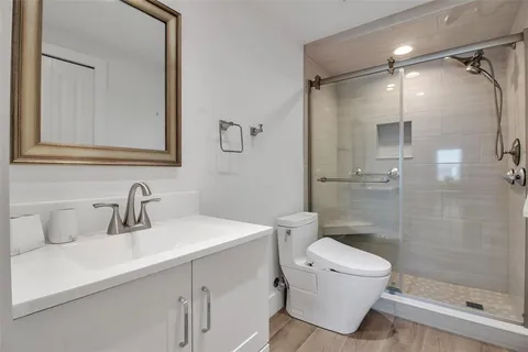 a view of a house with a big yard and potted plants