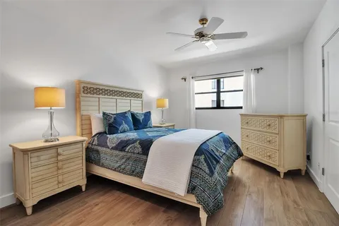 a view of a big building with a big yard and plants