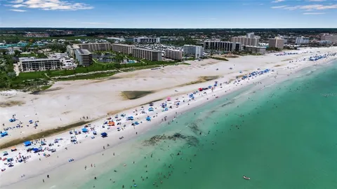 an aerial view of a residential houses with outdoor space