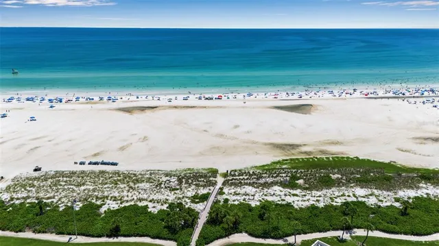 a view of a table and chairs in backyard of the house