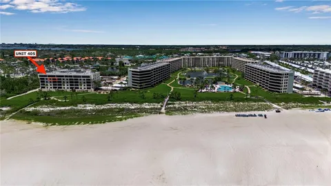 a large kitchen with a refrigerator and a sink