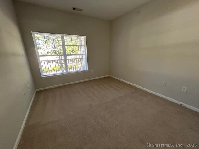 138 Hollow Tree Ridge Road, Unit 1523 Darien, CT 06820 - Photo 19 of 26 an empty room with a window