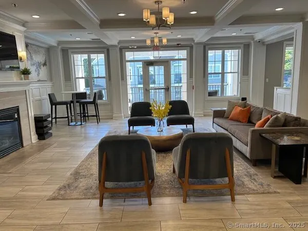 a living room with fireplace furniture and a flat screen tv