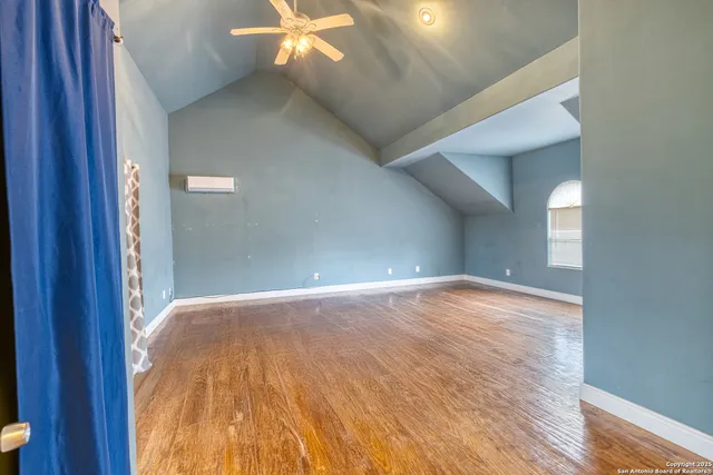a bathroom with a sink mirror and toilet