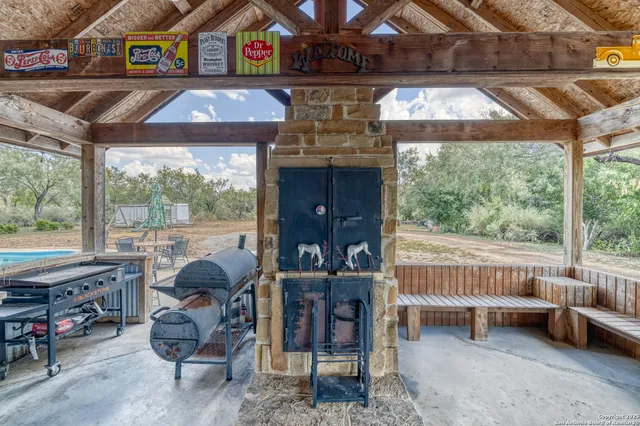 a view of a backyard with sitting area