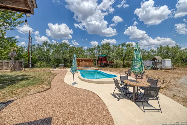 a view of a table and chairs in patio
