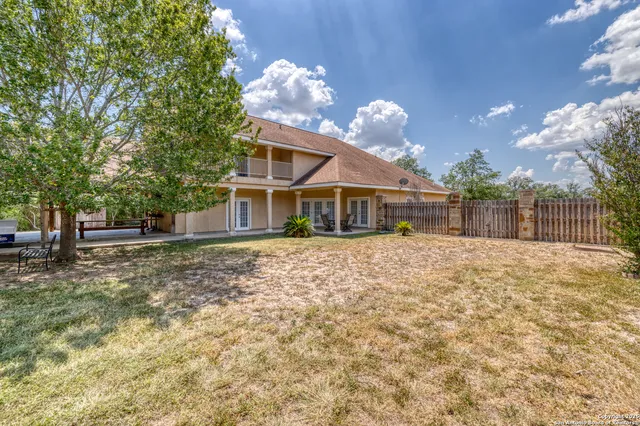 a view of backyard with green space