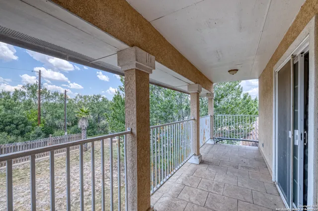 a view of a yard from a balcony