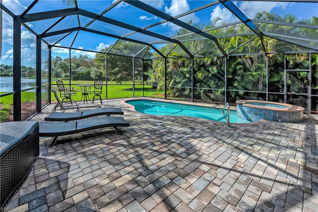 9215 Veneto Lane Naples, FL 34113 - Photo 18 of 34 a small garden covered with tall trees