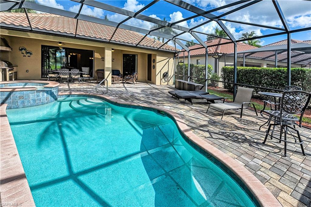 9215 Veneto Lane Naples, FL 34113 - Photo 19 of 34 a view of swimming pool with outdoor seating