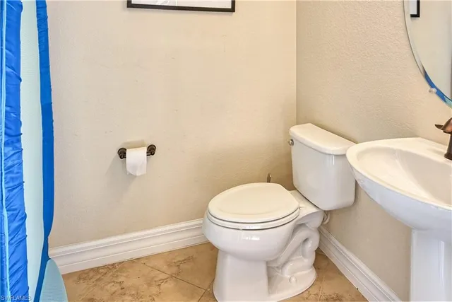 a bathroom with a toilet and a sink