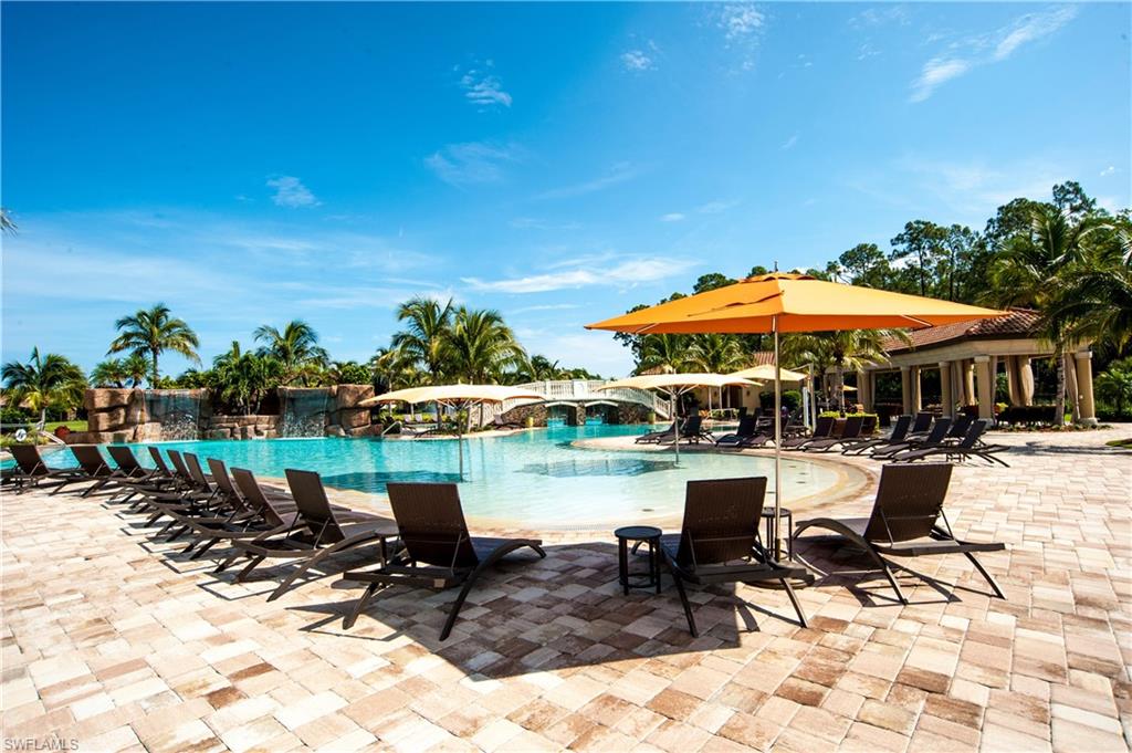 9215 Veneto Lane Naples, FL 34113 - Photo 28 of 34 a view of a swimming pool with chairs in patio