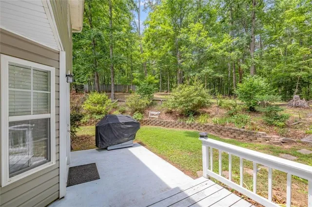 a view of a porch with furniture and garden