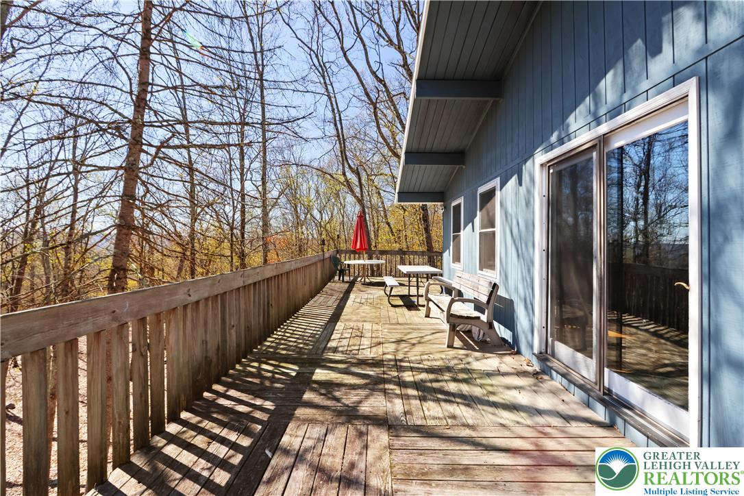 214 Mockingbird Court Bushkill, PA 18324 - Photo 2 of 40 a view of balcony with wooden floor and outdoor space