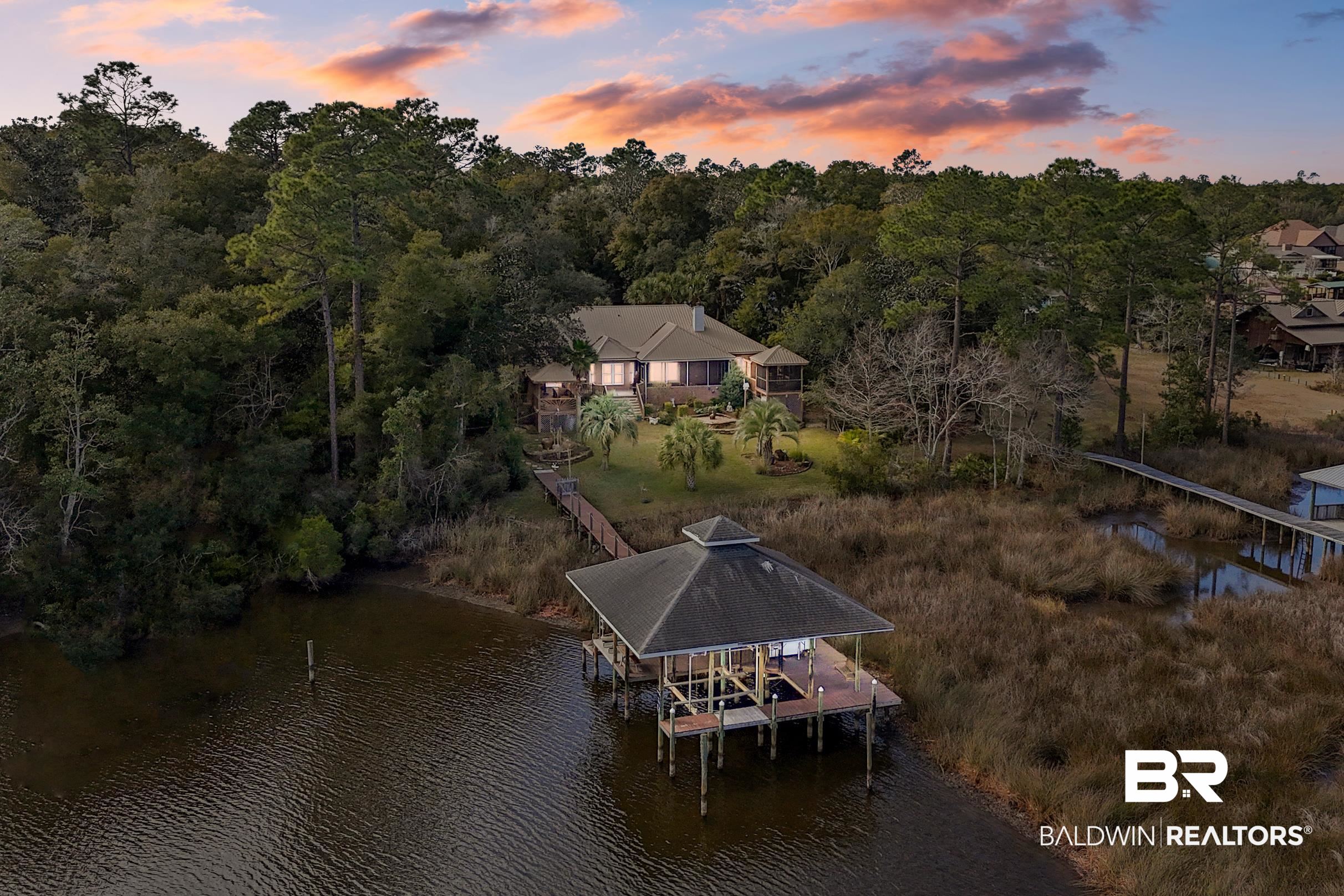 9370 Neumann Drive Elberta, AL 36530 - Photo 2 of 47 Aerial view at dusk featuring a water view