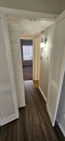 a view of an empty room and a window