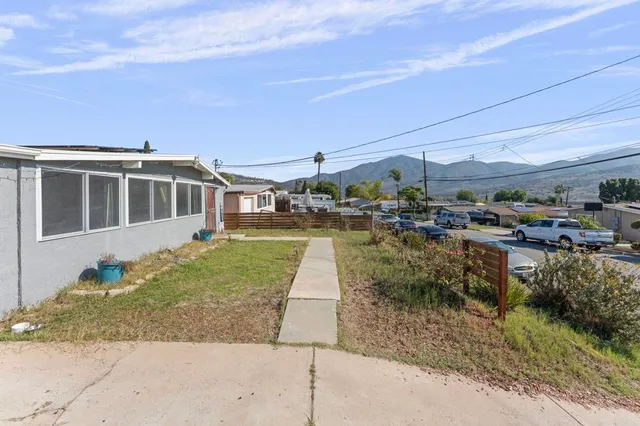 a view of a yard with sitting area