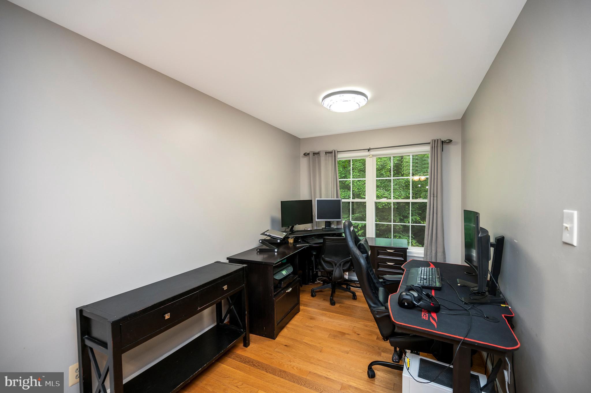 679 Cropp Road Fredericksburg, VA 22406 - Photo 25 of 39 a view of a workspace with furniture and a window