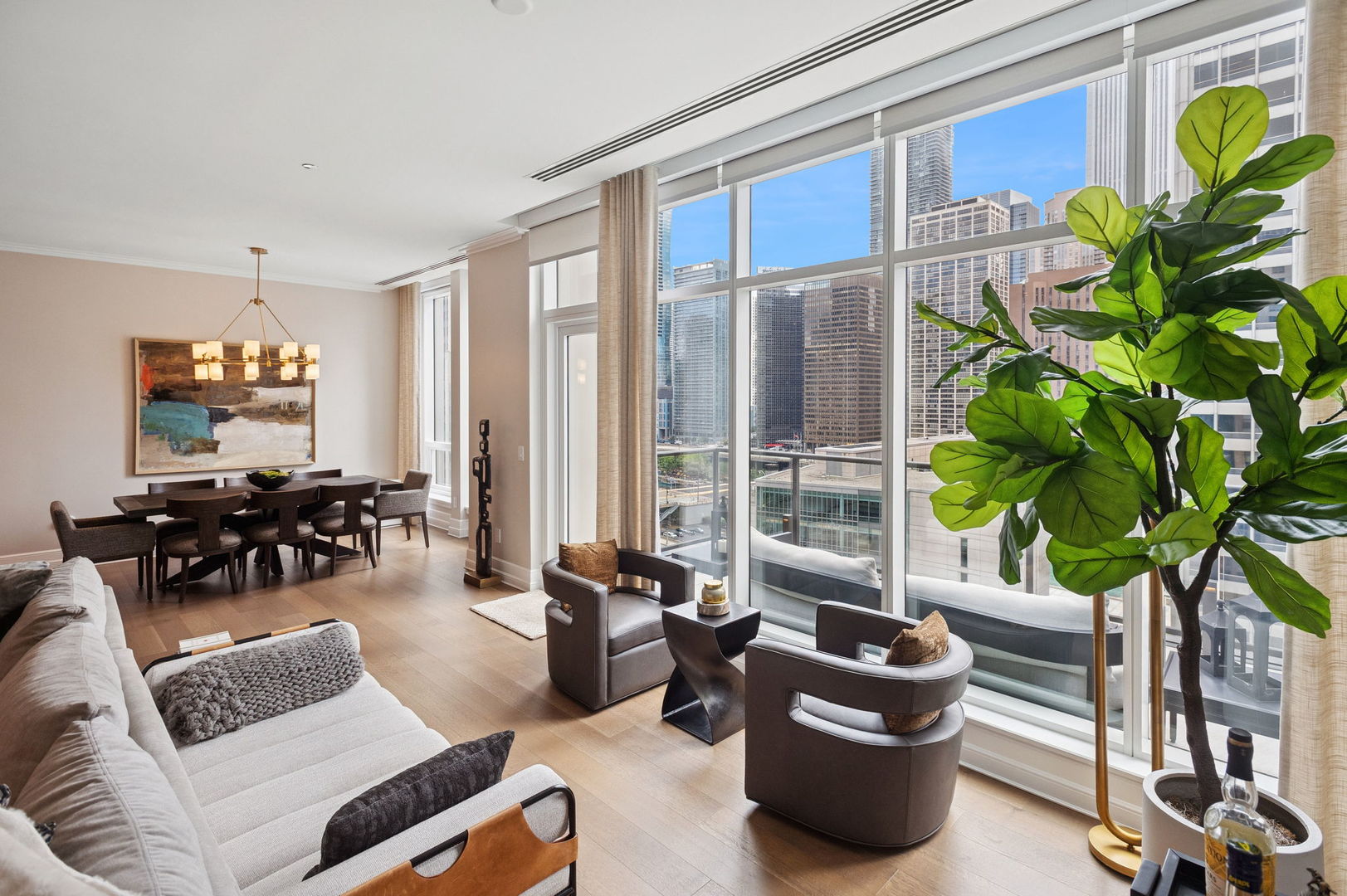 435 North Michigan Avenue, Unit 1112 Chicago, IL 60611 - Photo 15 of 70 a living room with furniture and a potted plant