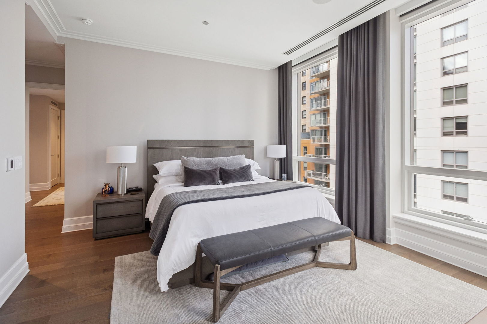 435 North Michigan Avenue, Unit 1112 Chicago, IL 60611 - Photo 27 of 70 a bed sitting in a bedroom next to a window