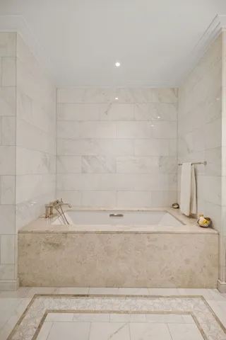 a bathroom with a shower sink and mirror