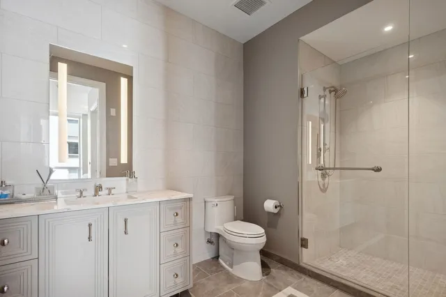 a living room with furniture a large window and flat screen tv