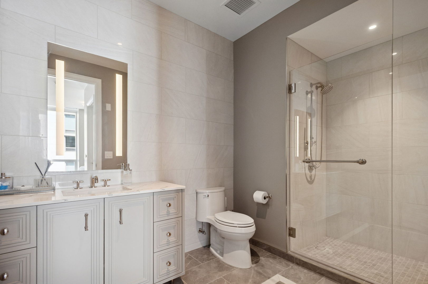 435 North Michigan Avenue, Unit 1112 Chicago, IL 60611 - Photo 36 of 70 a bathroom with a toilet sink and a mirror