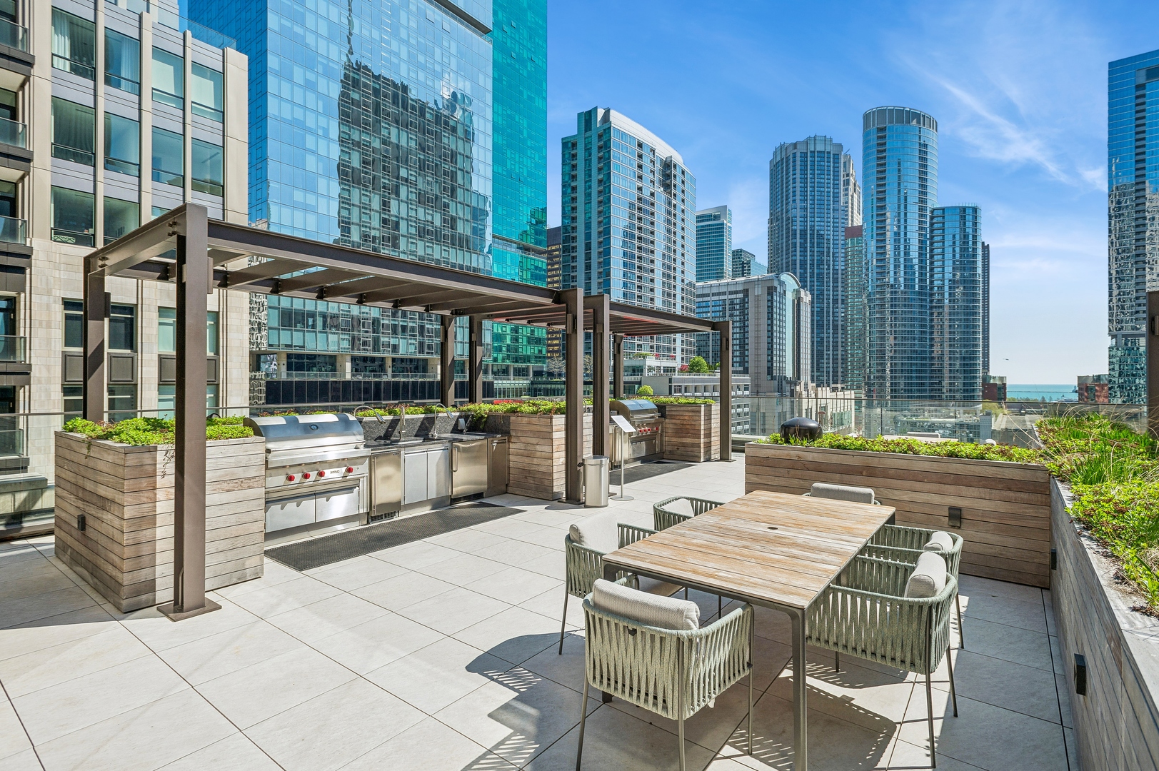 435 North Michigan Avenue, Unit 1112 Chicago, IL 60611 - Photo 55 of 70 a view of a patio with couches table and chairs and potted plants