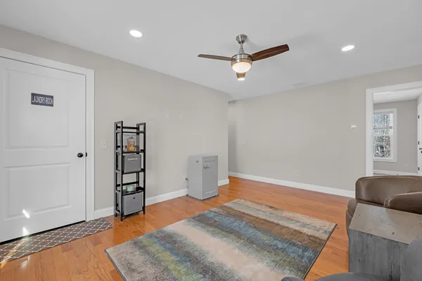 an empty room with closet and ceiling fan