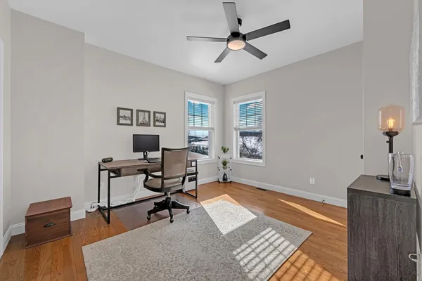 a living room with furniture a rug and a window