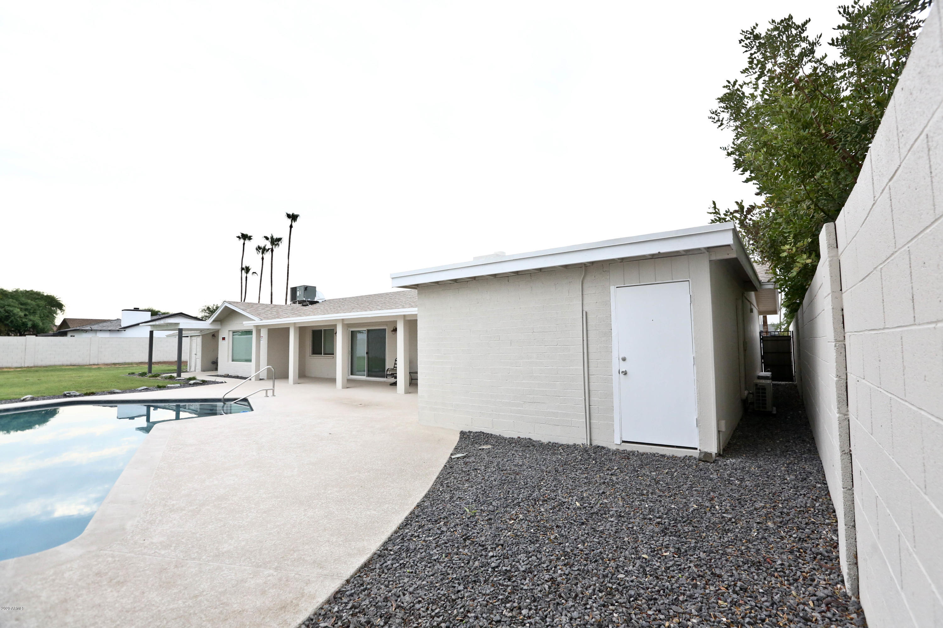 3414 East Camelback Road Phoenix, AZ 85018 - Photo 44 of 81 a front view of a house with a yard