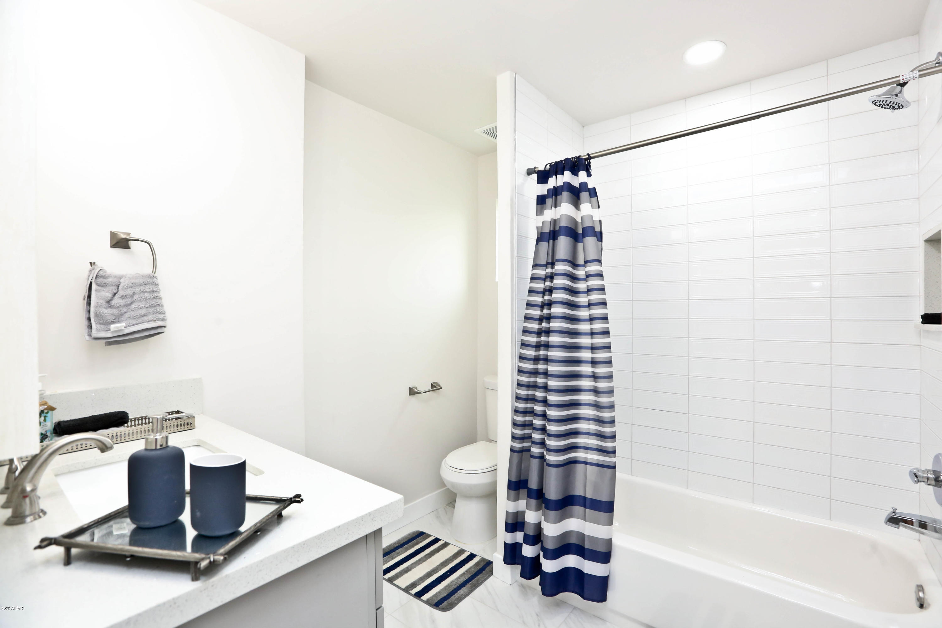 3414 East Camelback Road Phoenix, AZ 85018 - Photo 74 of 81 a bathroom with a bathtub shower sink and toilet