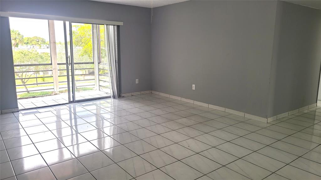 2800 Northwest 56th Avenue, Unit A305 Lauderhill, FL 33313 - Photo 4 of 15 a view of an empty room and window