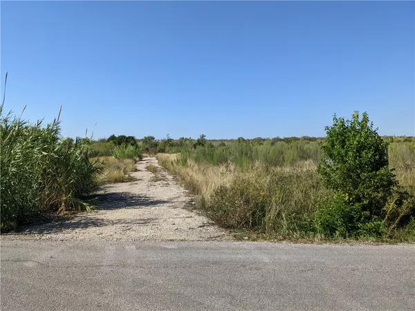 a view of a road with an ocean view