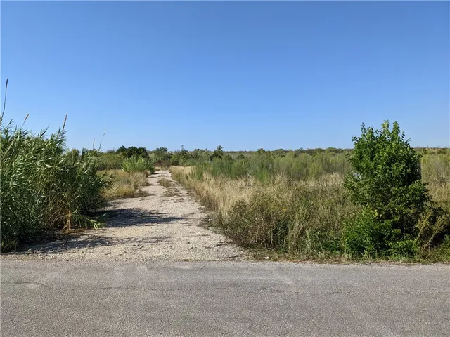 a view of a road with an ocean view