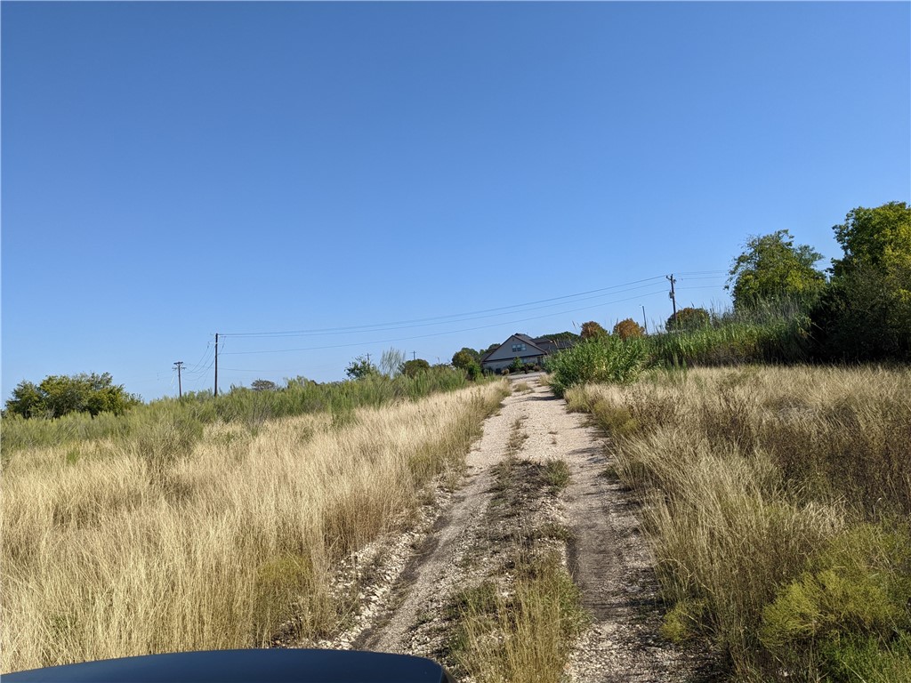 5534 Williamson Road Buda, TX 78610 - Photo 5 of 7 a view of a lake with a mountain in the background