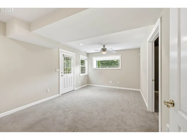 a view of a patio with couches table and chairs and potted plants