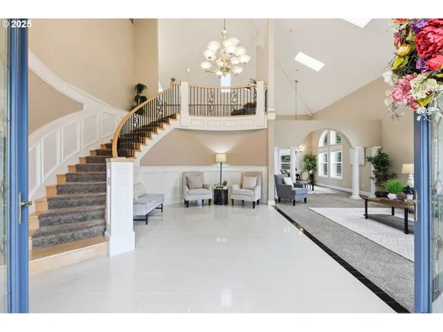 a living room with furniture chandelier and a chandelier