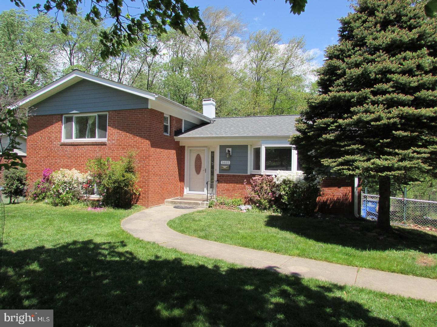 1615 Ladd Street Silver Spring, MD 20902 - Photo 1 of 3 a front view of a house with a yard