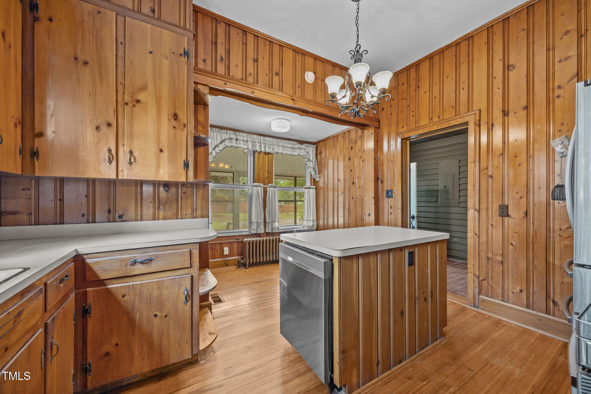 301 East H Street Erwin, NC 28339 - Photo 14 of 56 a kitchen with stainless steel appliances granite countertop a sink and a refrigerator