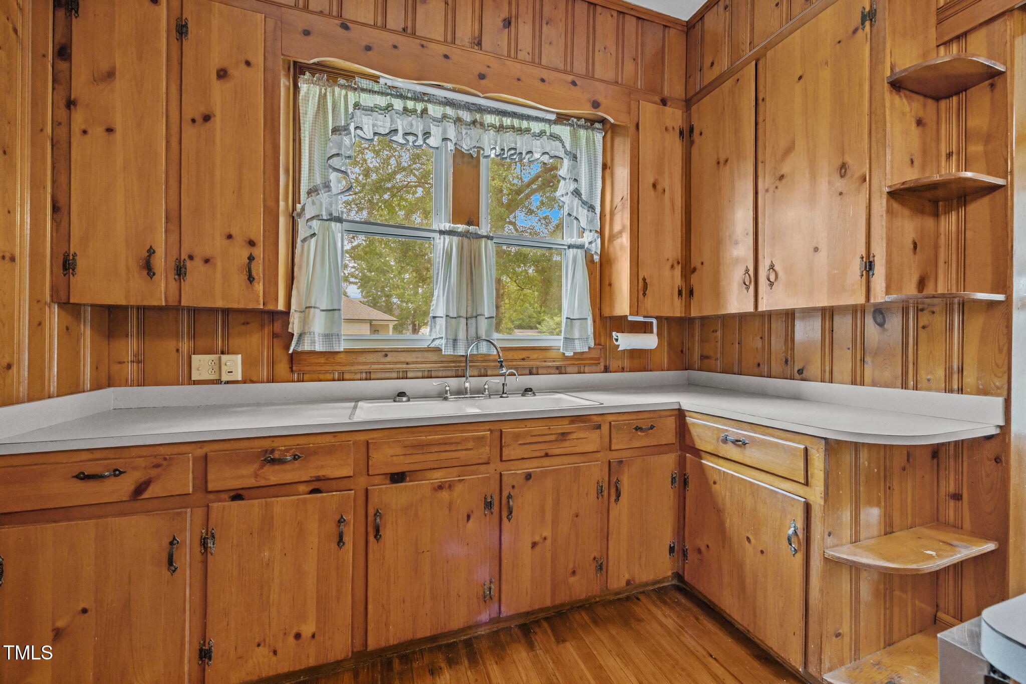 301 East H Street Erwin, NC 28339 - Photo 14 of 58 a kitchen with a sink and cabinets