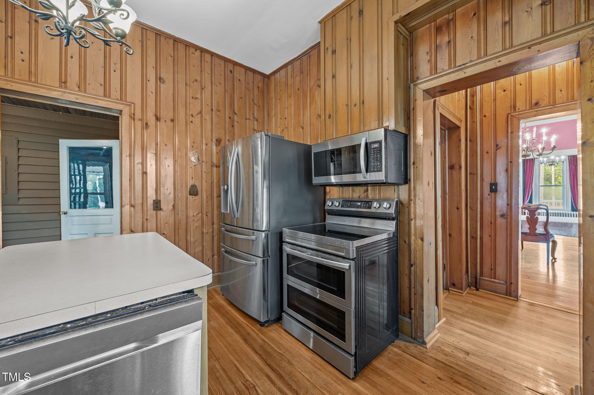 301 East H Street Erwin, NC 28339 - Photo 16 of 58 a kitchen with stainless steel appliances a refrigerator and a stove