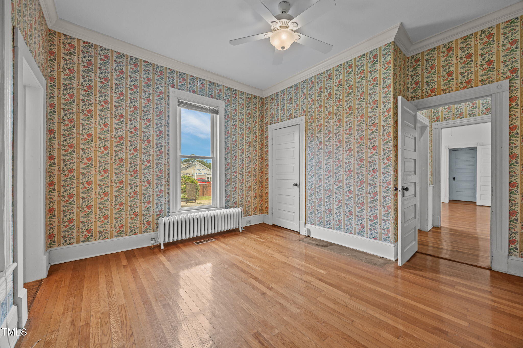 301 East H Street Erwin, NC 28339 - Photo 21 of 58 wooden floor in an empty room with a window
